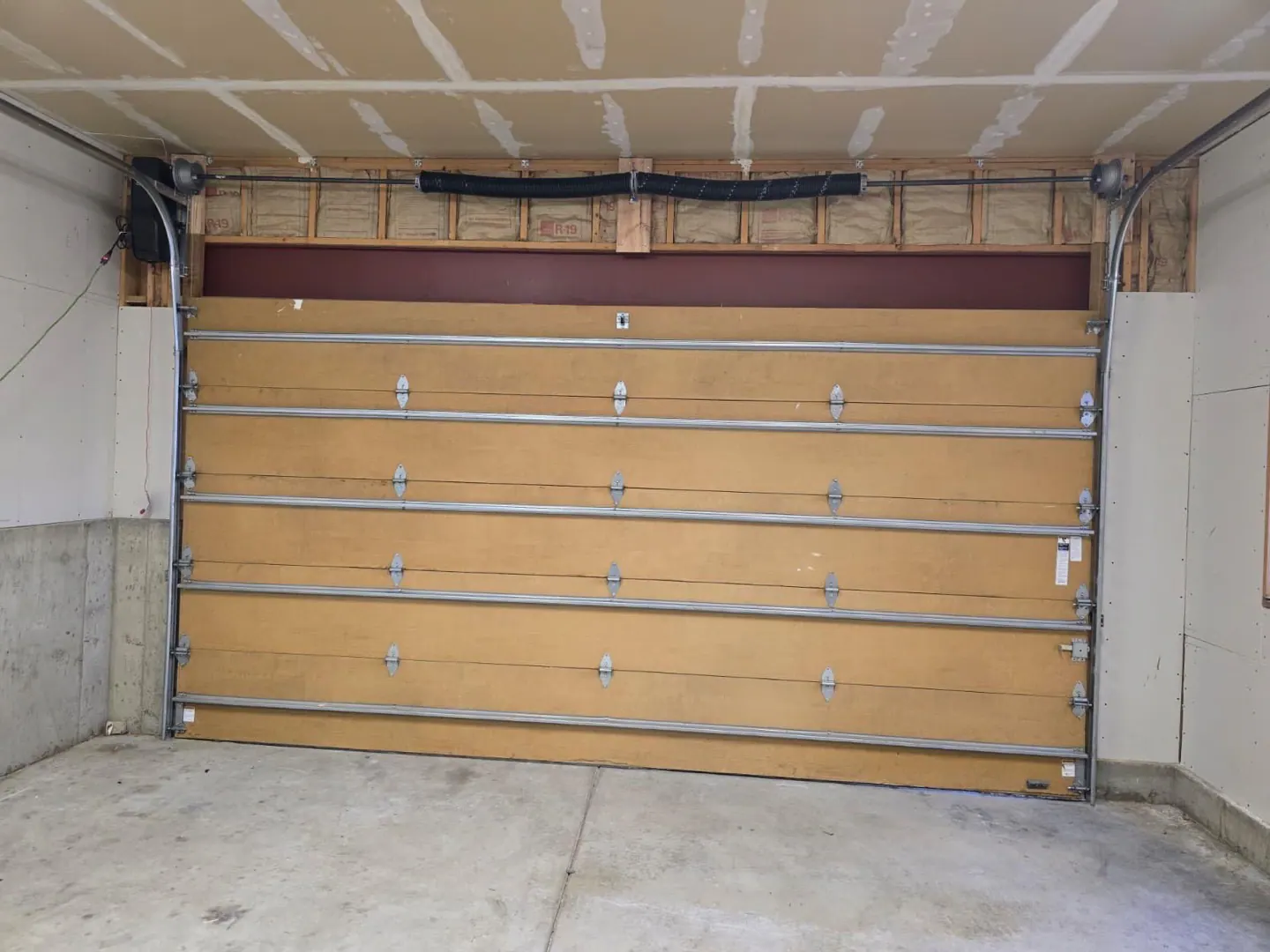 Garage door track raised after high-lift conversion