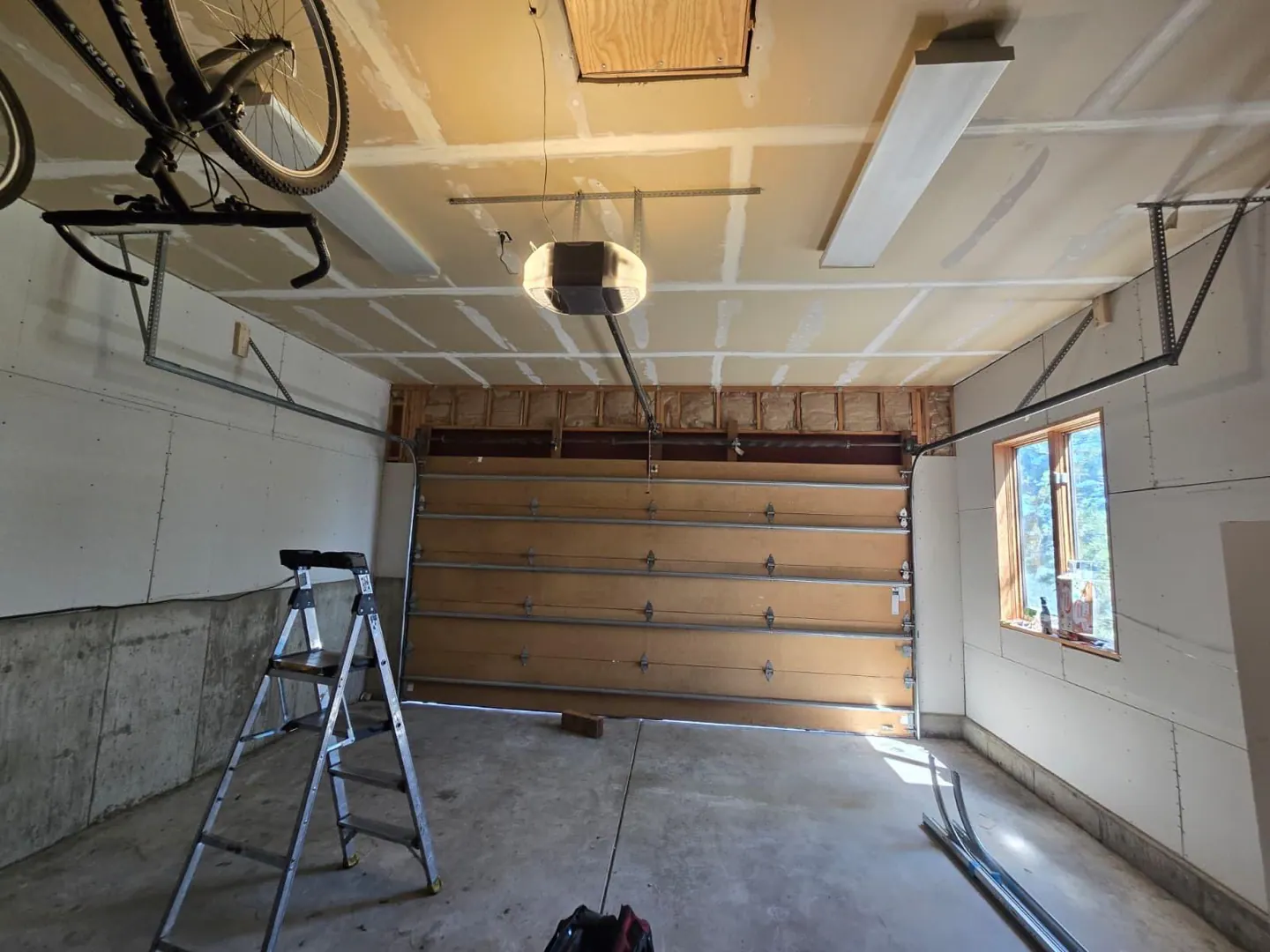 Garage door track before high-lift conversion