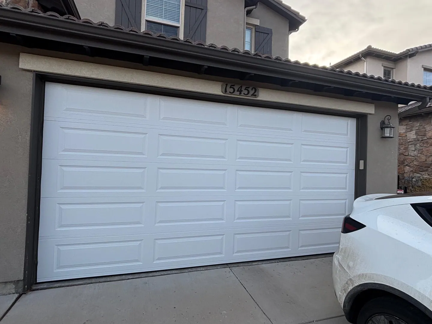 New white garage door after replacement