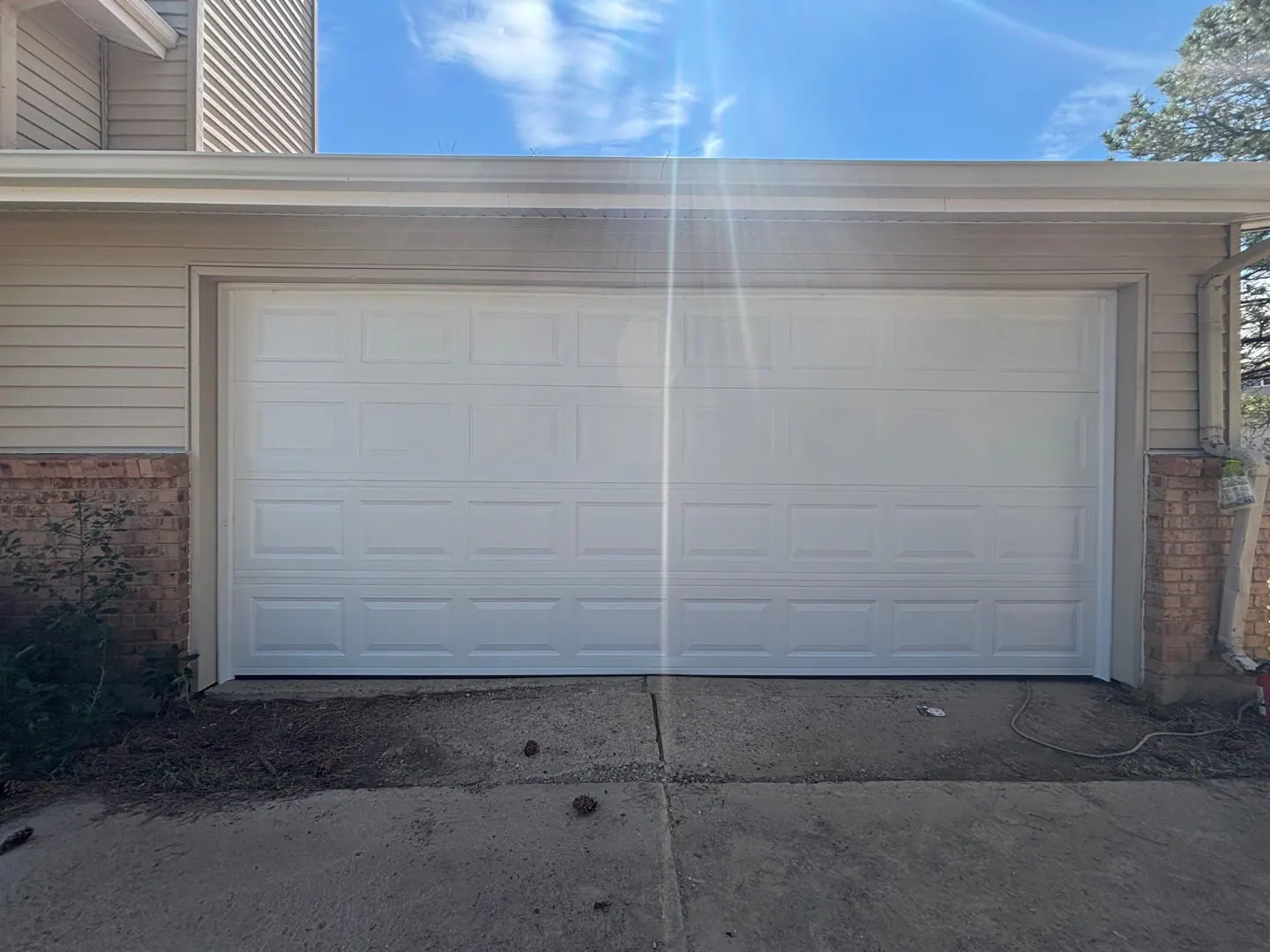 Garage door aligned and closed after repair
